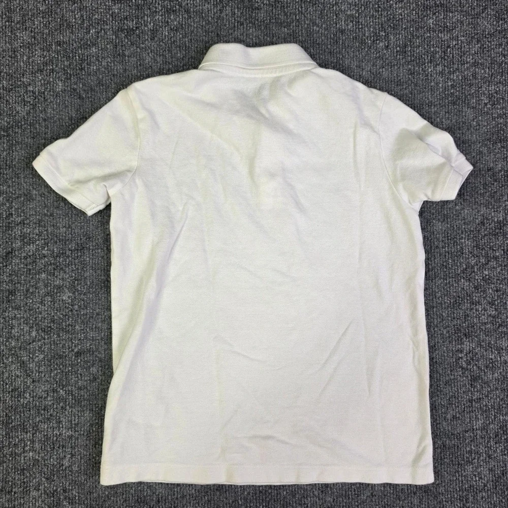 Kids Old Navy white polo shirt in size S (6-7)